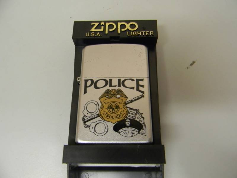 lot 56 image: NOS STILL IN THE BOX FROM POLICE ZIPPO LIGHTER - SEE PICTURES