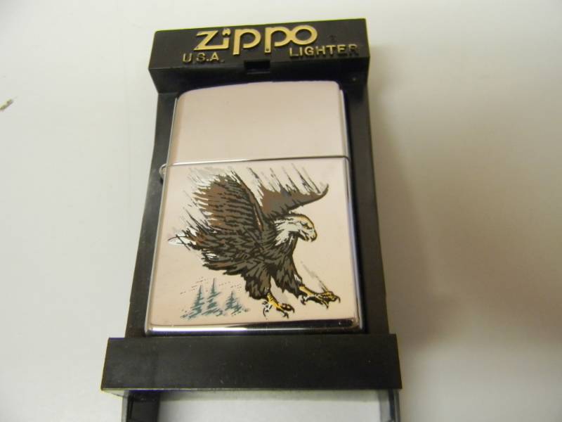 lot 58 image: NOS STILL IN THE BOX EAGLE ZIPPO LIGHTER - SEE PICTURES