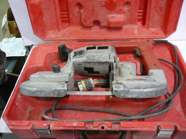 lot 14 image: Milwaukee Hand Held Band Saw With Case
