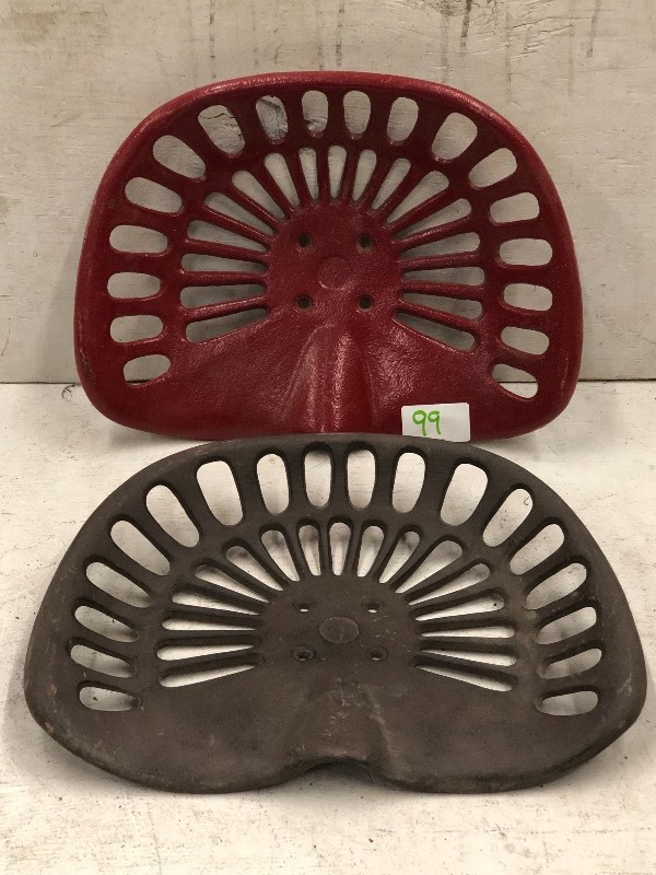 lot 99 image: (2) Cast Iron Tractor Seats