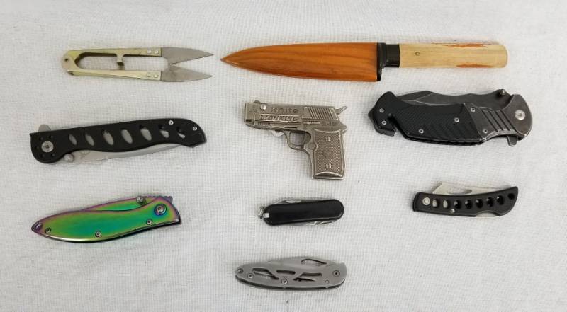 lot 106 image: Lot of Knives and Lighters, Gun Knife with Built-in Lighter, Etc.