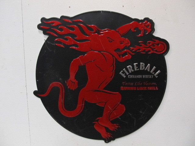 lot 42 image: Large Embossed Metal Fireball Whiskey Sign