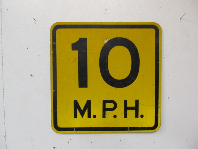 lot 46 image: Vintage 10 M.P.H. Speed Limit Sign