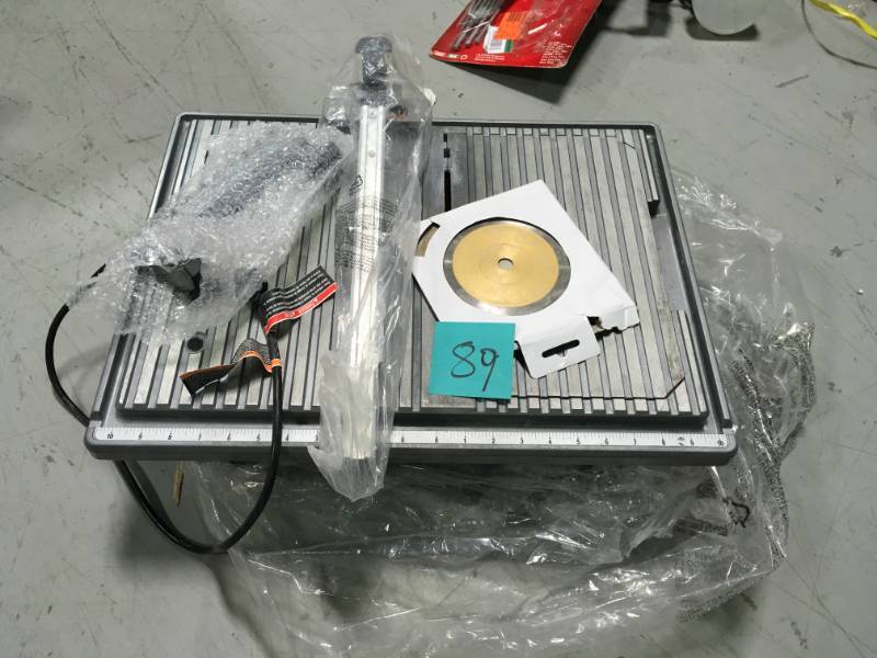 lot 89 image: RIDGID 120-Volt 7 in. Table Top Wet Tile Saw used in working condition