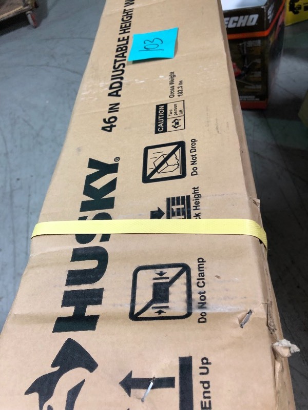 lot 103 image: Husky 46 in. Adjustable Height Work Table NEW