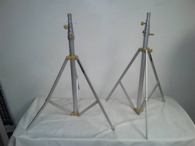 lot 99 image: 2 alloy tripods in hard case.
