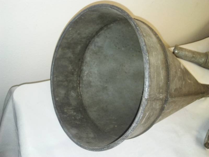 lot 108 image: 2 large metal funnels and oil spout.