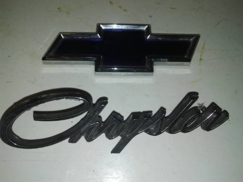 lot 152 image: Auto emblems blue Chevy bowtie and Chrysler.