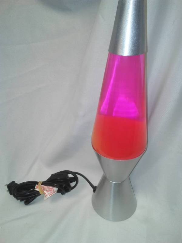lot 169 image: Pink  orange lava lamp NEW without box, 14 in tall.
