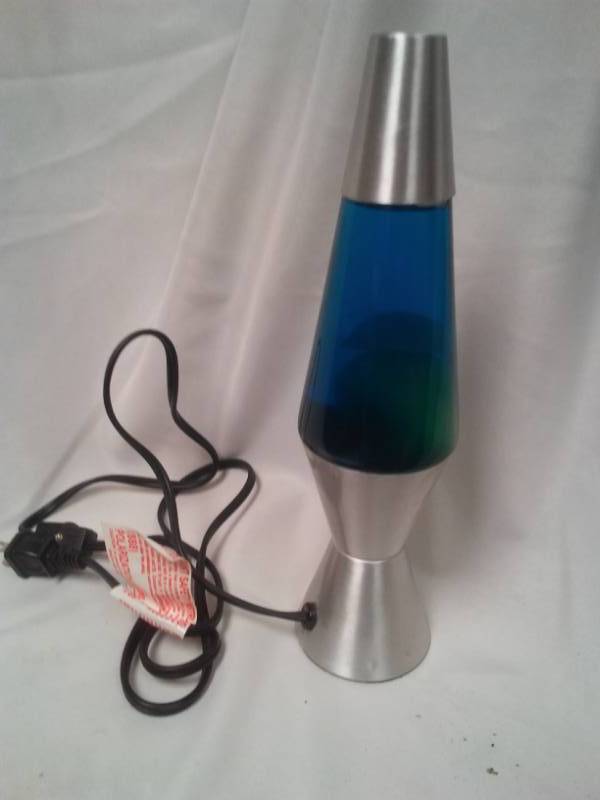 lot 174 image: Blue  yellow lava lamp NEW no box, 11.5 in tall.