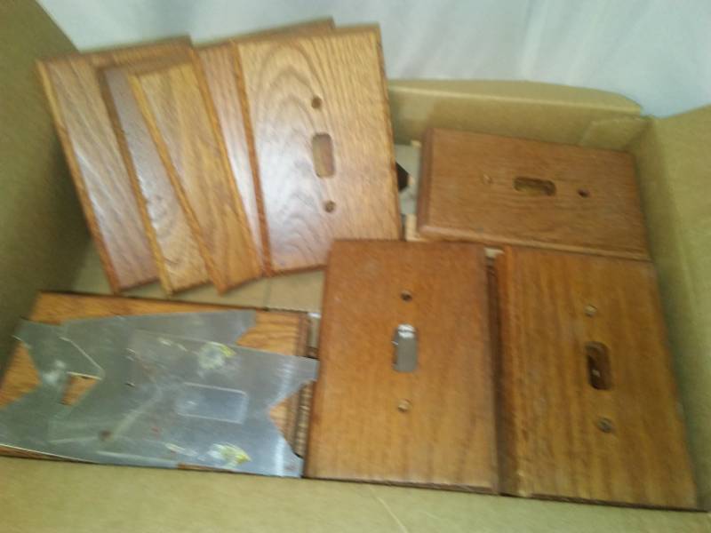 lot 218 image: 30 Oak switch faceplates.