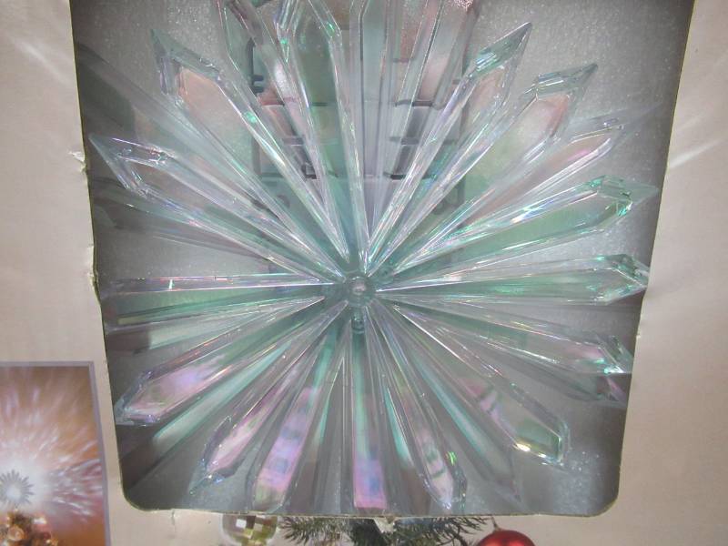 lot 69 image: LightShow 19.29 in. Projection Tree Topper-Kaleidoscope-Starburst (White), Model 39765