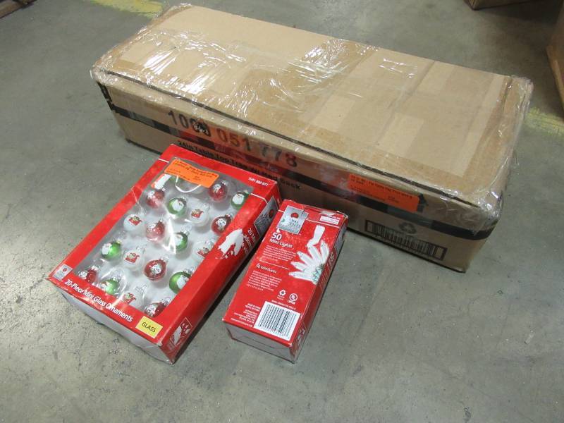 lot 26 image: Home Accents Holiday 24 in. 65-Tip Table Top Tree with Red Sack, TYT-14049RED