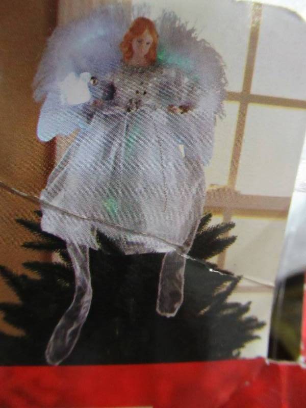 lot 279 image: Home Accents Holiday 12 in. LED Angel Silver Tree Topper, A-7070B