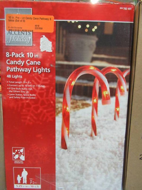lot 204 image: 3 Boxes of Home Accents Holiday 10 in. Pre-Lit Candy Cane Pathway Stakes (Set of 8), TY166-1118