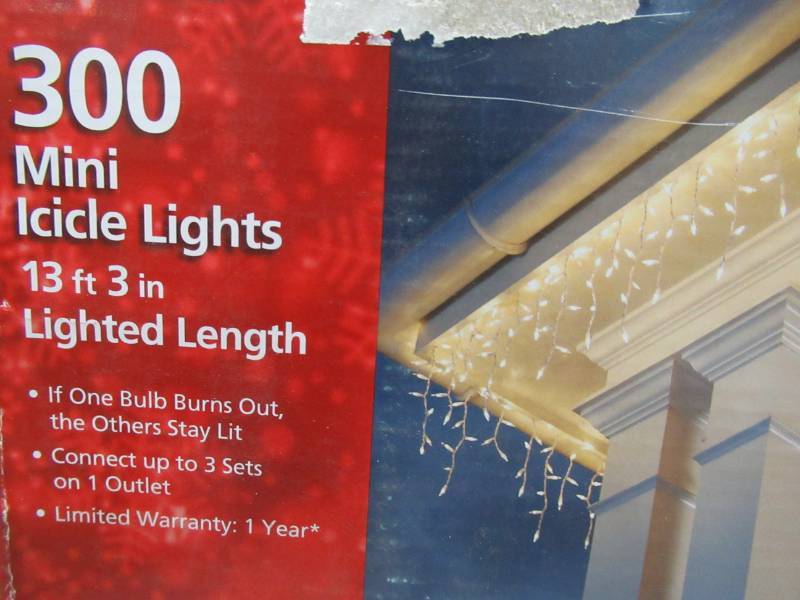 lot 187 image: 4 Boxes of Home Accents Holiday 300-Light Clear Icicle Light Sets, White Cord, TOL-3006WB(C)C