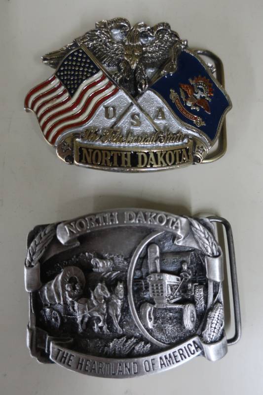 lot 378 image: Two North Dakota Themed Belt Buckles