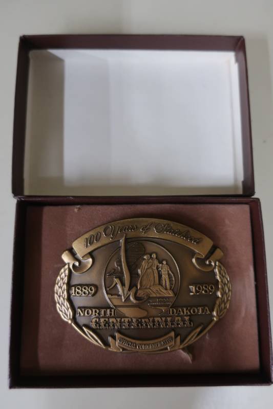 lot 393 image: North Dakota Centennial Belt Buckle in Box