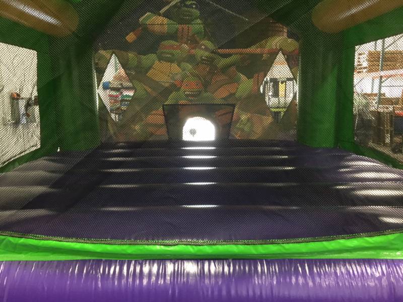 lot 10 image: Ninja Turtle Bouncer 15 Ft x 15 Ft