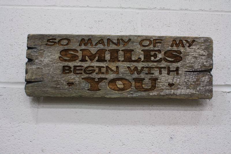 lot 35 image: So many of my smiles begin with you Handmade Wood Sign