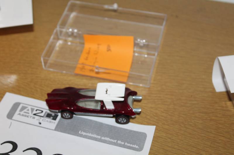 lot 329 image: 1969 Hot Wheels Redline Swingin Wing Die Case Metal Car with Clear Plastic Display Case