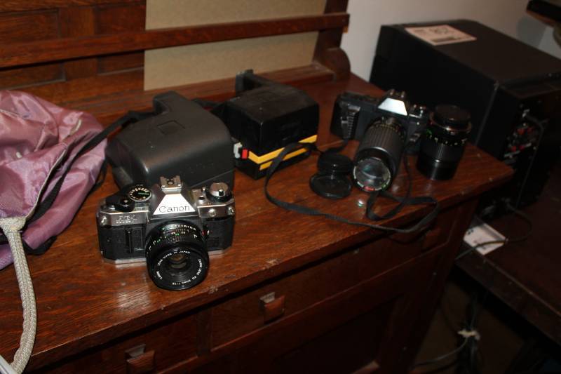 lot 392 image: Canon Vintage Cameras - AE1 Program 35mm Film, T50 35mm Film, Lens, Case