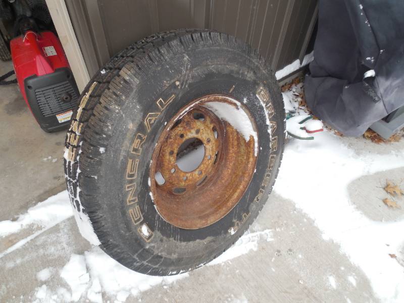 lot 6 image: NEW 235  85  16 TIRE MOUNTED ON A 8 BOLT RIM