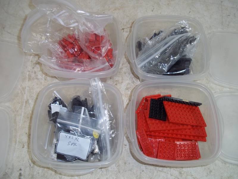lot 160 image: Legos with 4 storage boxes
