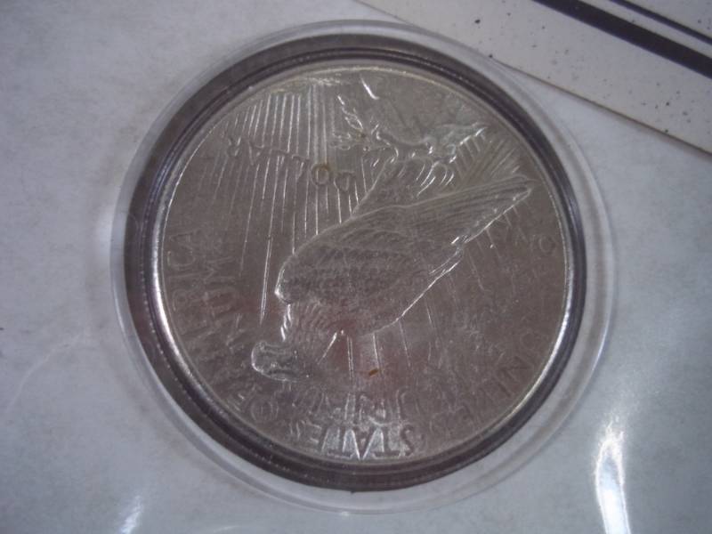 lot 200 image: 1925 Peace Dollar with postage stamp