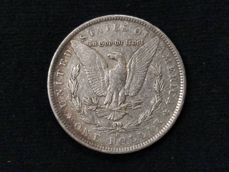 lot 12 image: 1885 O Morgan Silver Dollar...