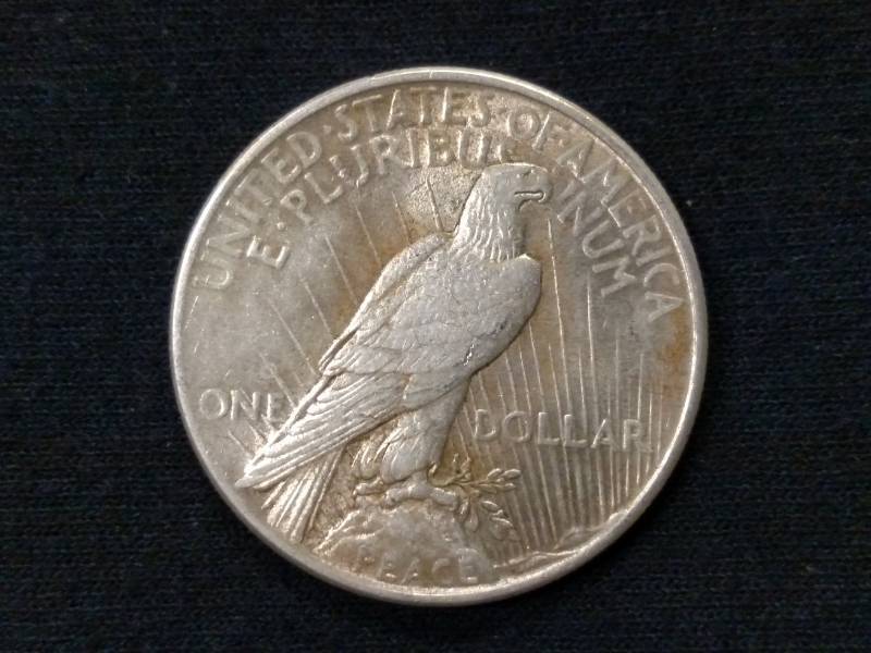 lot 31 image: 1925 Peace Silver Dollar...