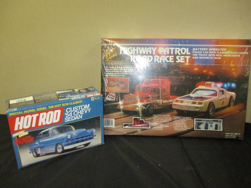 lot 64 image: Highway Patrol Road Race Set still in the plastic and Custom 54  Chevy Sedan