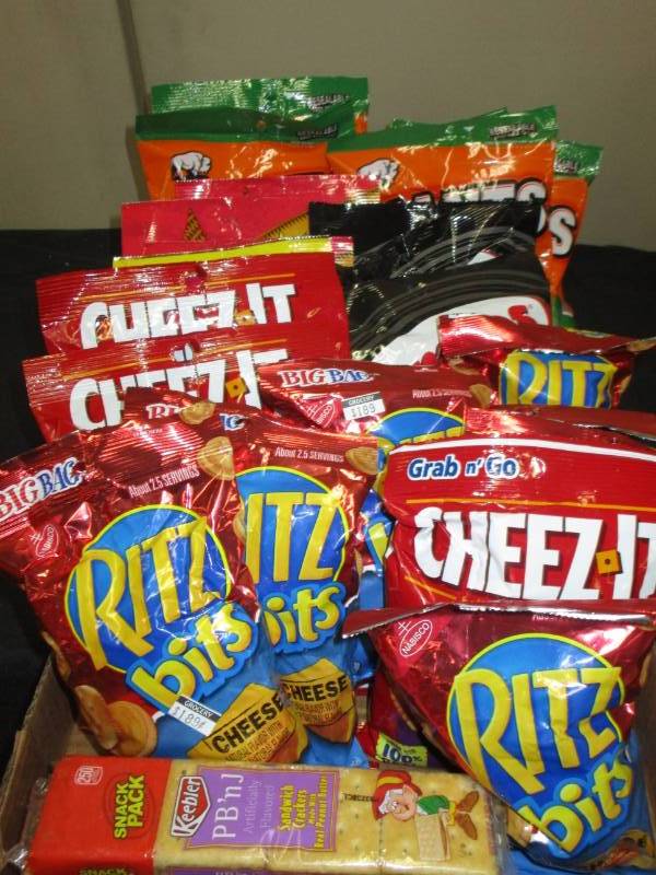 lot 242 image: 24 various crackers, corn nuts, pumpkin seeds and combos