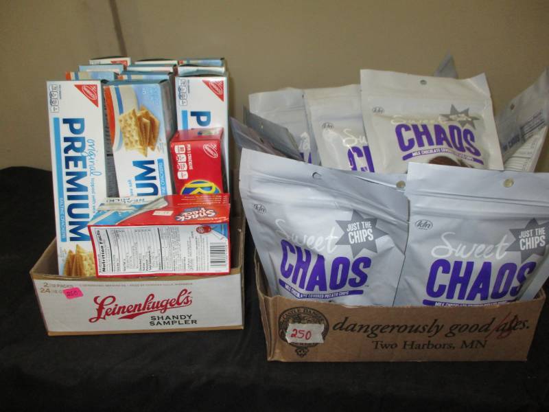 lot 250 image: 12 boxes of crackers, and 18 bags of chocolate covered chips