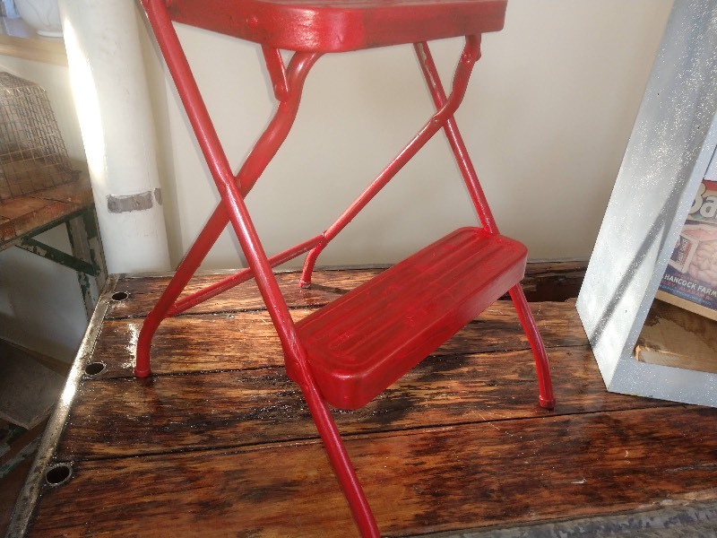 lot 16 image: Red Step Stool Chair, Six Drawer Vertical File Cabinet, Bama Yams Advertising, Orange Jack-O-Lantern Pottery
