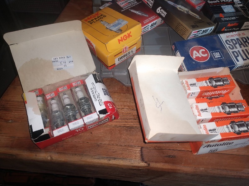 lot 33 image: Spark Plugs, GM10 Strut Tool, Brake Parts, and Other Car Parts