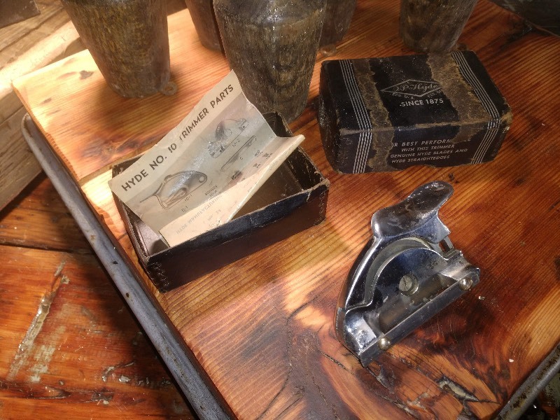 lot 83 image: Vintage Elevator Box, Vintage Wood Screw On Furniture Legs,  Vintage J.P. Hyde No. 10 Trimmer with Box and Parts Sheet