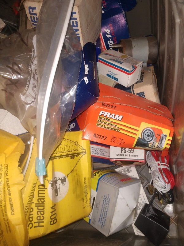 lot 86 image: Clear Tote of Fuel Filters, Starter Solenoids, Valves, Ball Joints and Other Car Accessories