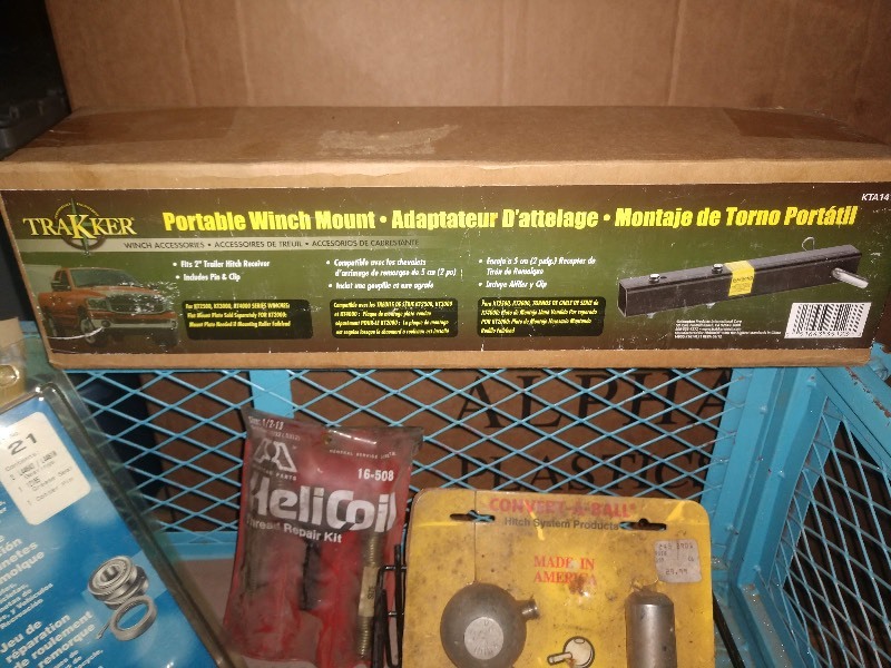 lot 96 image: Hurst El Camino Part, FRAM Tough Guard Premium Air Filters, OTC Front Hub Installer, Grease Gun Coupler, Portable Winch Mount, Trailer Bearing Repair Kit, HeliCoil Thread Repair Kit, Convert-A-Ball, 1-78 Ball Coupler
