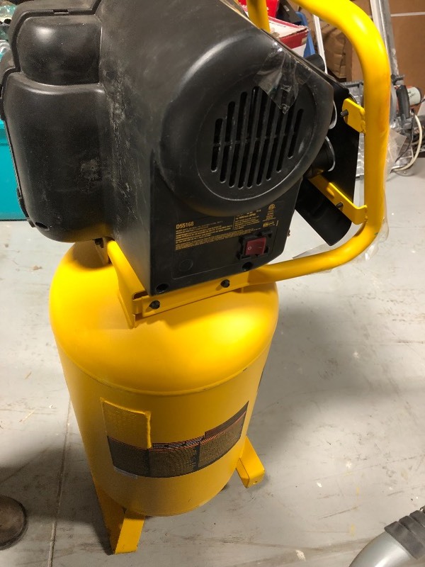 lot 111 image: DEWALT 15 Gal. Portable Electric Air Compressor in good working conditions missing wheels