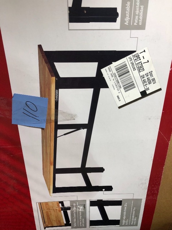 lot 110 image: Husky 42 in. H x 72 in. W x 24 in. D Steel and Wood Folding Adjustable Height Garage Workbench in Black in good conditions