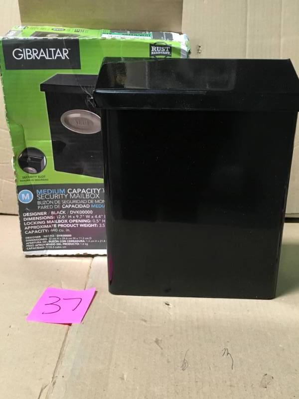 lot 37 image: Gibraltar Mailboxes Designer White Satin Nickel Decorative Emblem Vertical Wall-Mount Locking Mailbox in like new condition