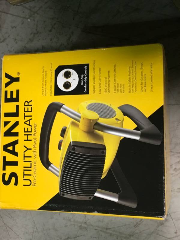 lot 92 image: Stanley Heaters 1500-Watt Utility Ceramic Portable Heater with Pivot Power Yellow CCD35340