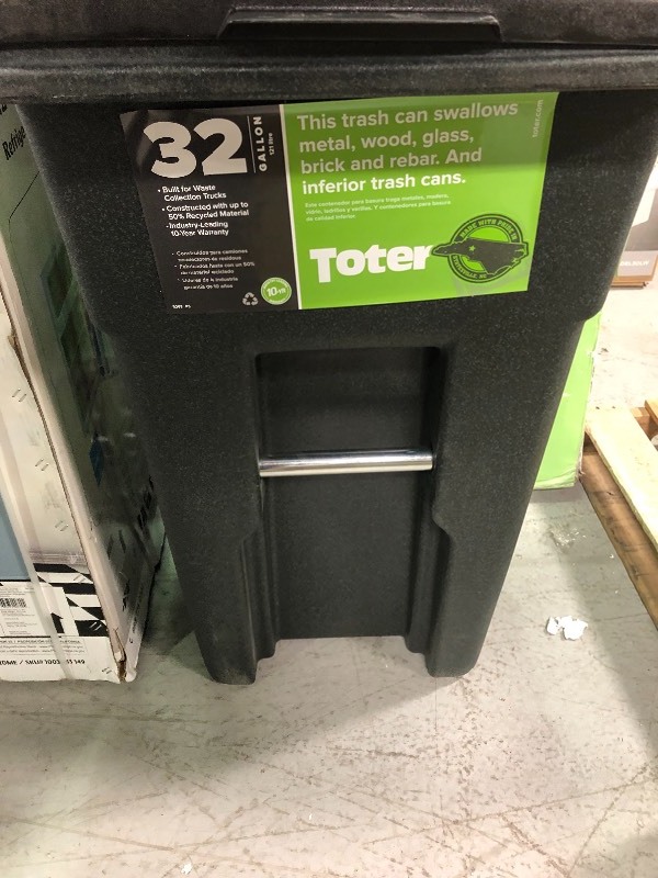 lot 109 image: Toter 32 Gal. Greenstone Trash Can with Wheels and Attached Lid in good conditions