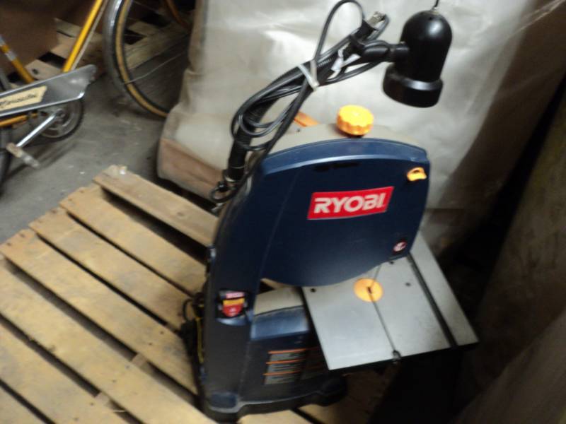lot 1 image: Ryobi electric bands saw with an at...