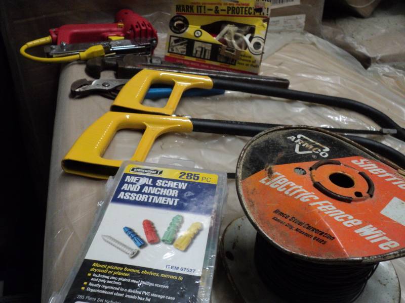 lot 32 image: saws, wire, stapler, and misc in  a...