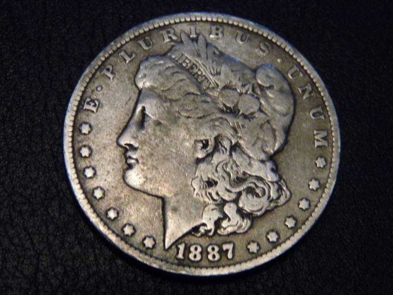 lot 7 image: 1887 O  Morgan Silver Dollar