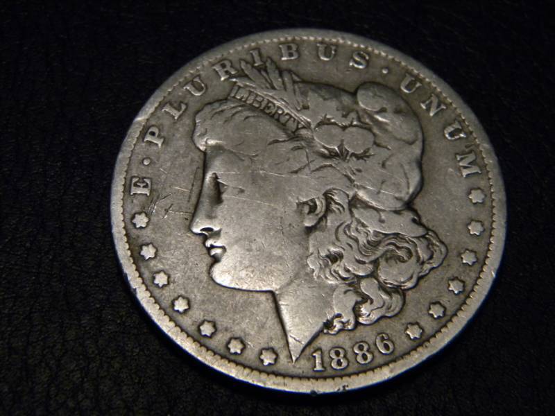 lot 20 image: 1886 O  Morgan Silver Dollar