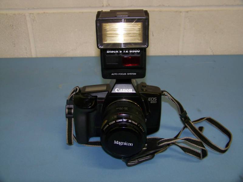 lot 82 image: Canon, EOS 605, Film  Still-Shot Camera with Zoom Lens, Flash Attachment and Travel Bag