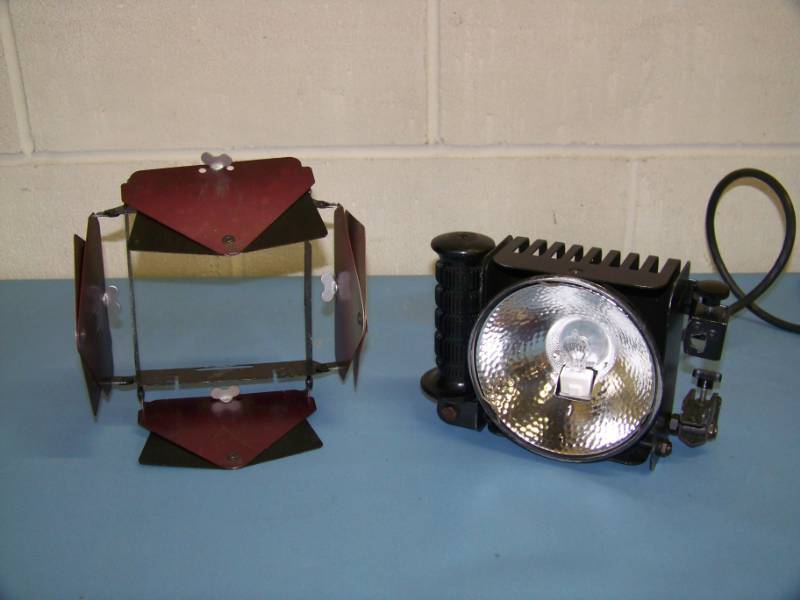lot 83 image: Lowel, OMNI-Light, Spot  Flood Light with Handle, Switch and Barn Door Attachment
